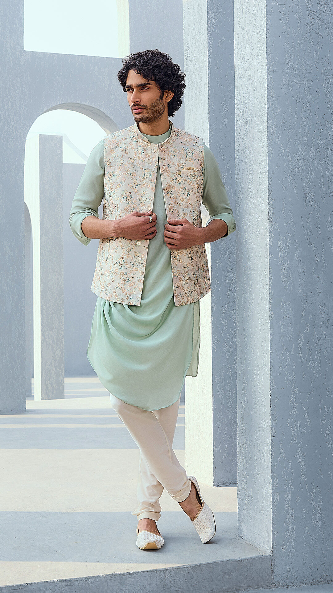 Groom wearing a white kurta for his engagement photoshoot